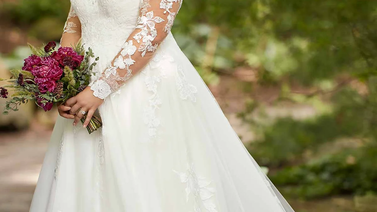 blue bowl of black bean beef tortilla soup on a board with cilantro and shredded cheese in background