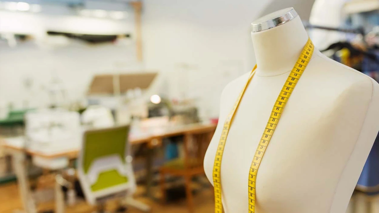 Close up on a plate of mashed potatoes, topped with baked pork chops with cream of mushroom soup, and a side of green beans.