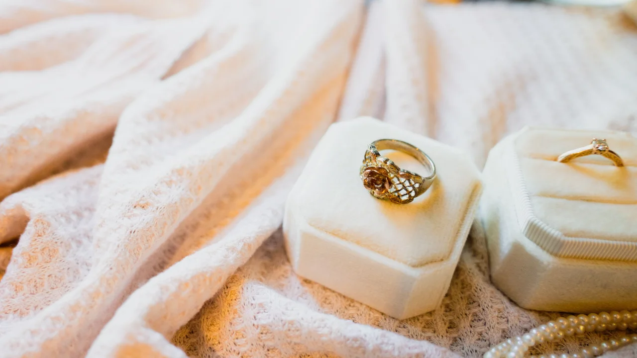 blue bowl of black bean beef tortilla soup on a board with cilantro and shredded cheese in background